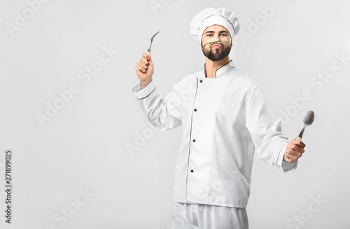 Fototapeta Funny male chef on white background