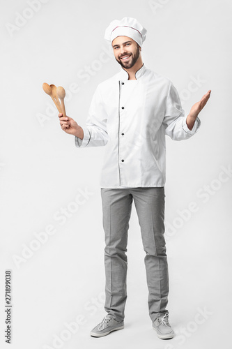 Handsome male chef on white...