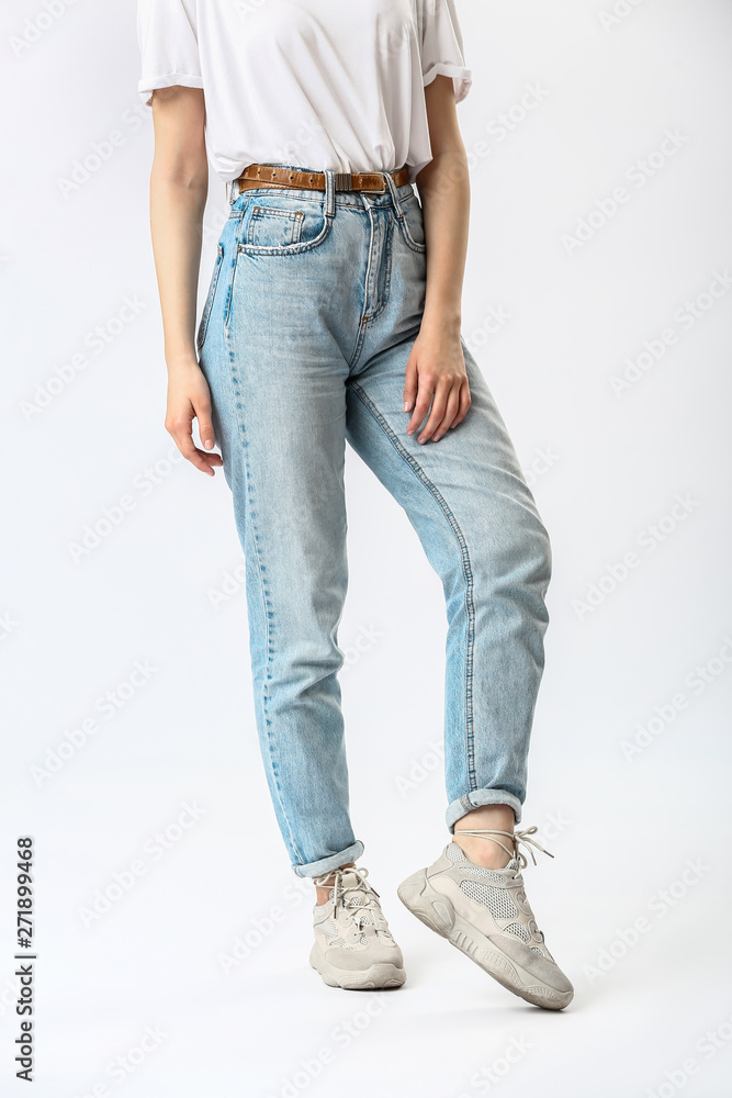 Stylish young woman in jeans on white background Stylish young woman in jeans on white background