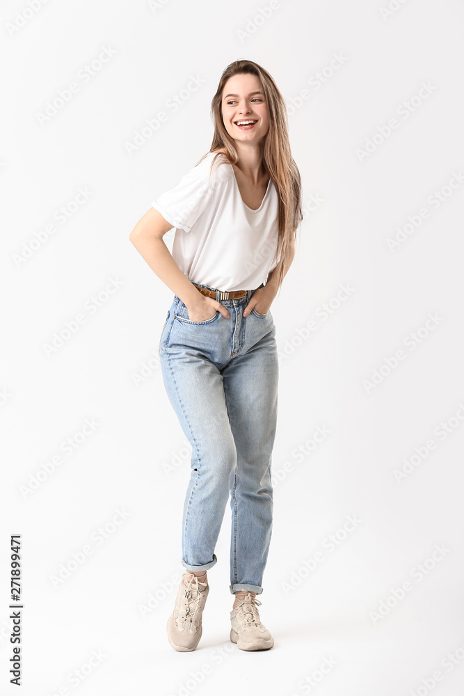 Stylish young woman in jeans on white background Stylish young woman in jeans on white background
