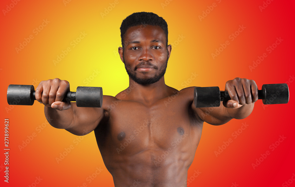 Portrait of a bare chested African American athlete isolated