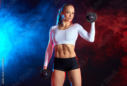 awesome girl is good at weightlifting and bodybuilding.close up photo. leisure concept