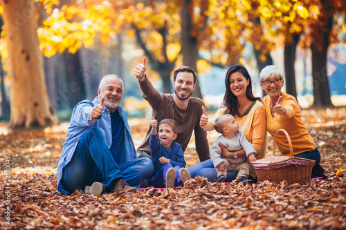 Multl generation family in autumn park having fun