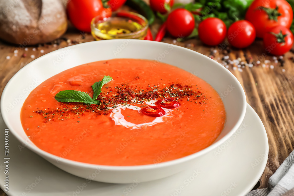 Bowl of tasty tomato cream soup on table Bowl of tasty tomato cream soup on table