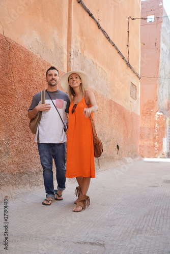 Attractive couple walking through streets in Marrakech