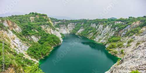 Panoramic view of emerald pond at Grand Canyon Khiri in Thailand. It originated from substances dissolved in water in old abandoned mine.