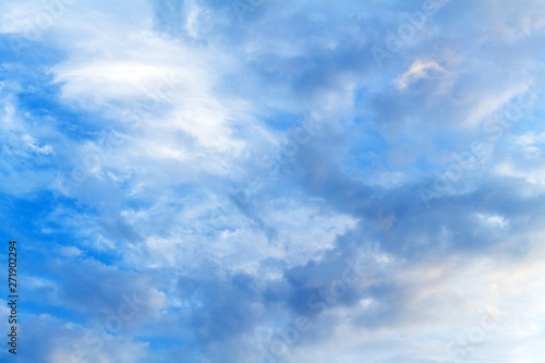 Blue sky with picturesque fluffy clouds background