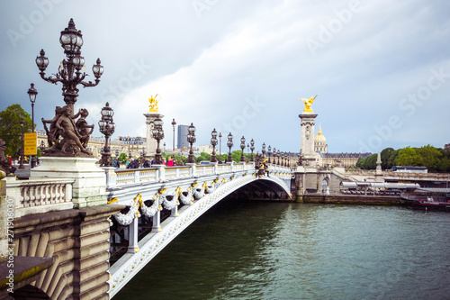 Beautiful view of Pont Alexandre III, bridge with golden sculptures and street lamps, Paris, France