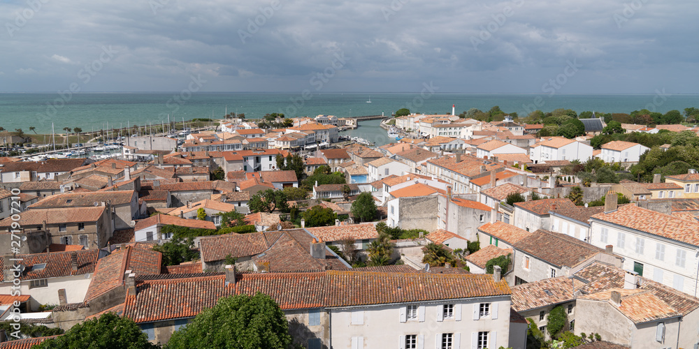 Roofs and atlantic ocean in Saint-Martin-de-Ré at Ile de Re in web banner template web