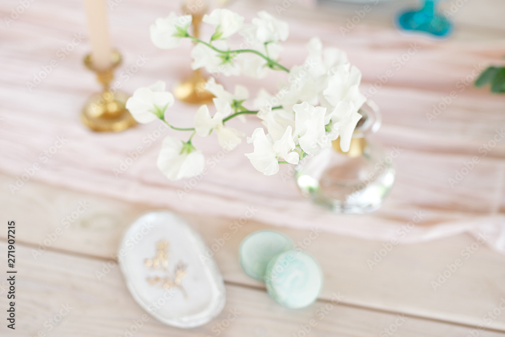 Sweet french macaroons on wood flat lay copyspace. Top voew on set of three purple macaroons on wooden board, lying diagonally on wooden table, void