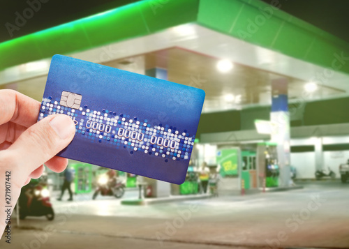 Credit card to make a payment for refueling car on gas station photo