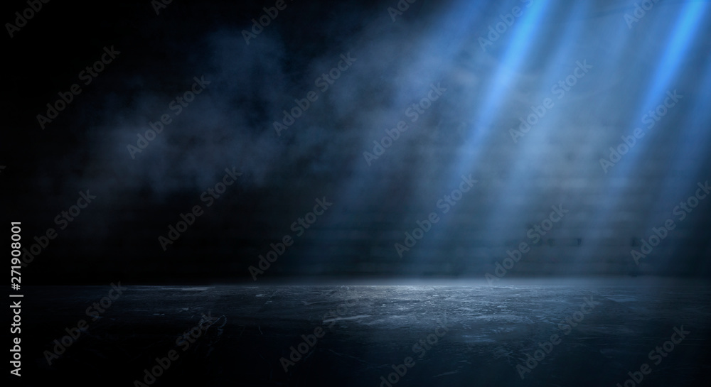 Dark empty scene, blue neon searchlight light, wet asphalt, smoke, night view, rays. Empty black studio room. Dark background. Abstract dark empty studio room texture.  Product showcase spotlight back