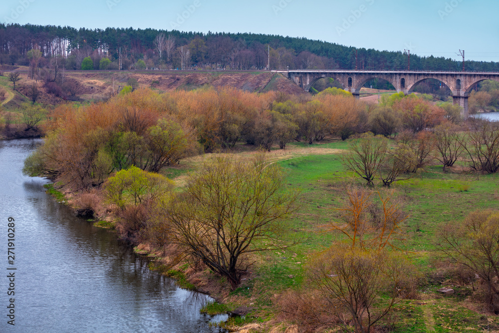 Aqueduct bridge over the river in early spring Aqueduct bridge over the river in early spring