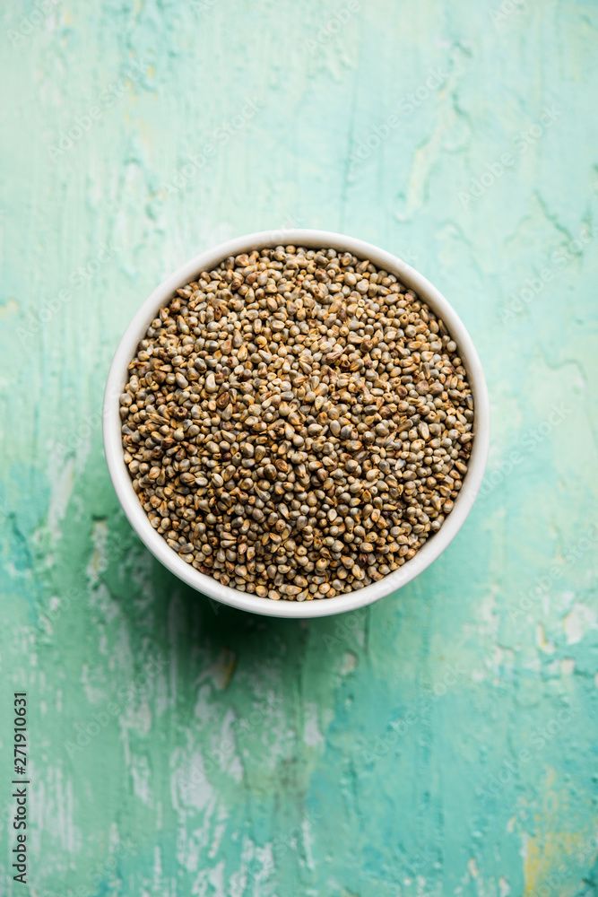 Pearl Millet or Bajra seeds also known as sorghum, in a bowl, selective focus Pearl Millet or Bajra seeds also known as sorghum, in a bowl, selective focus