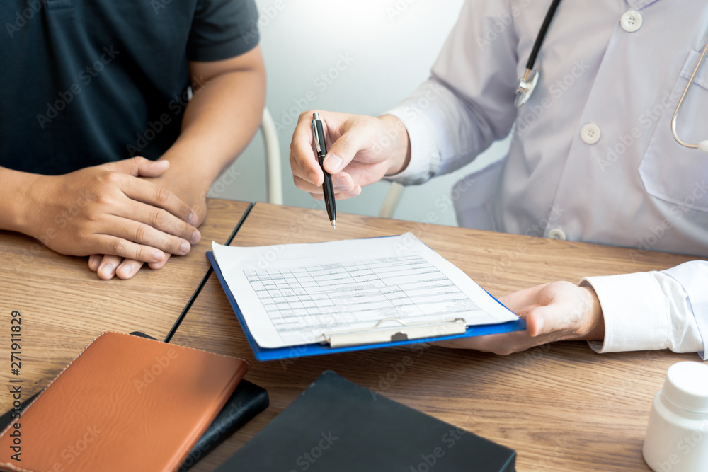 Doctor explaining and giving a consultation to a patient medical informations and diagnosis about the treatment for condition in hospital, medical ethics concept. Doctor explaining and giving a consultation to a patient medical informations and diagnosis about the treatment for condition in hospital, medical ethics concept.