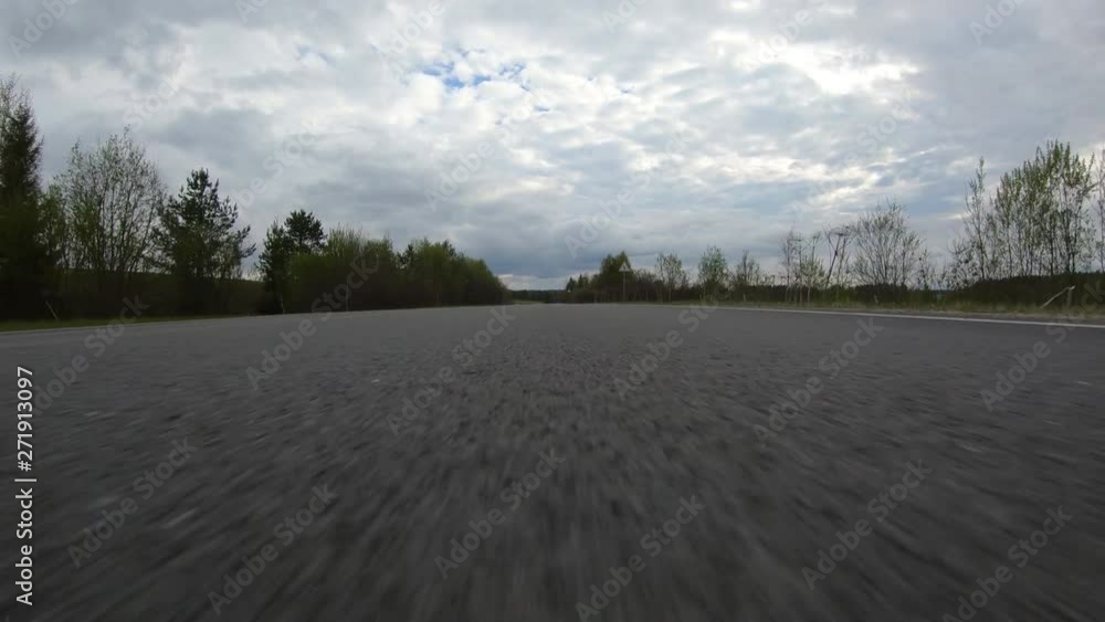 Asphalt road.The car goes at high speed.High-speed driving on the highway. Asphalt road.The car goes at high speed.High-speed driving on the highway.
