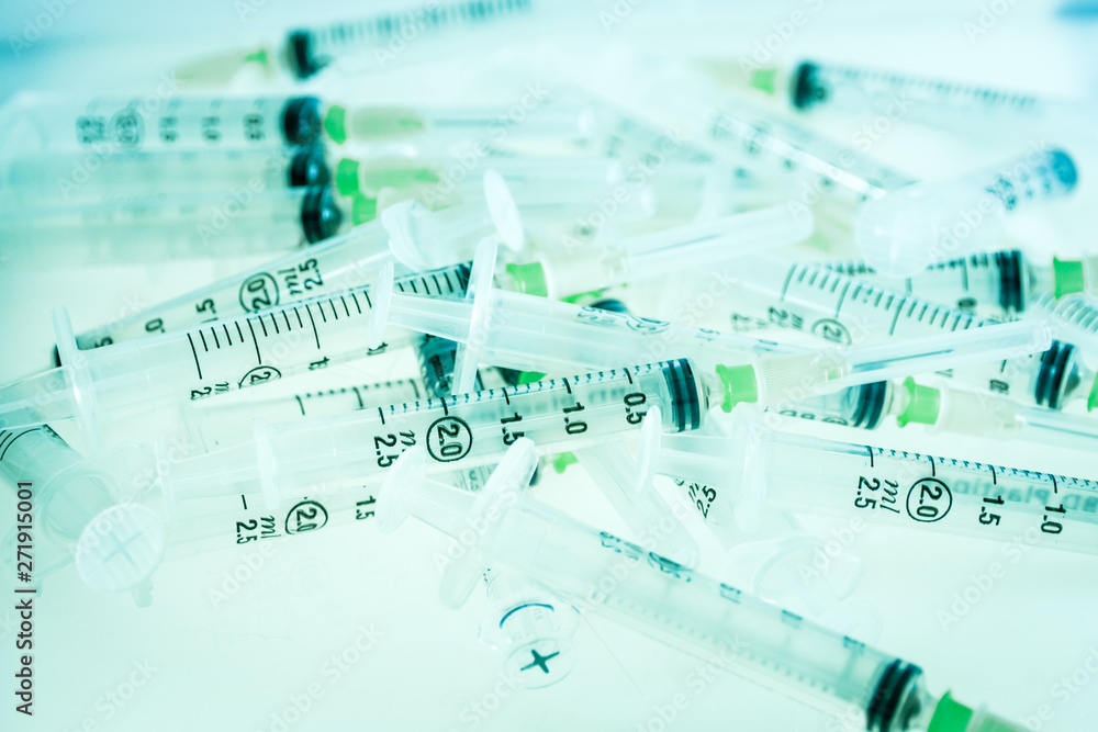 Syringes on blue background Syringes on blue background