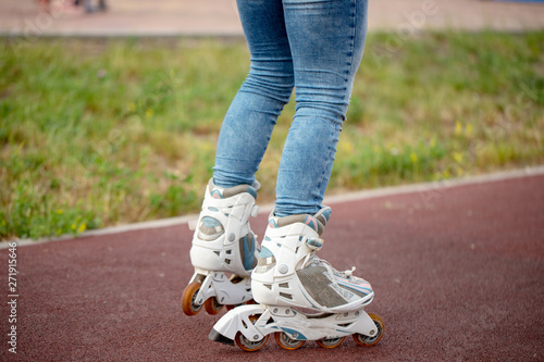 Roller skate legs close up in skatepark. Low section. Roller skates is extreme sport.