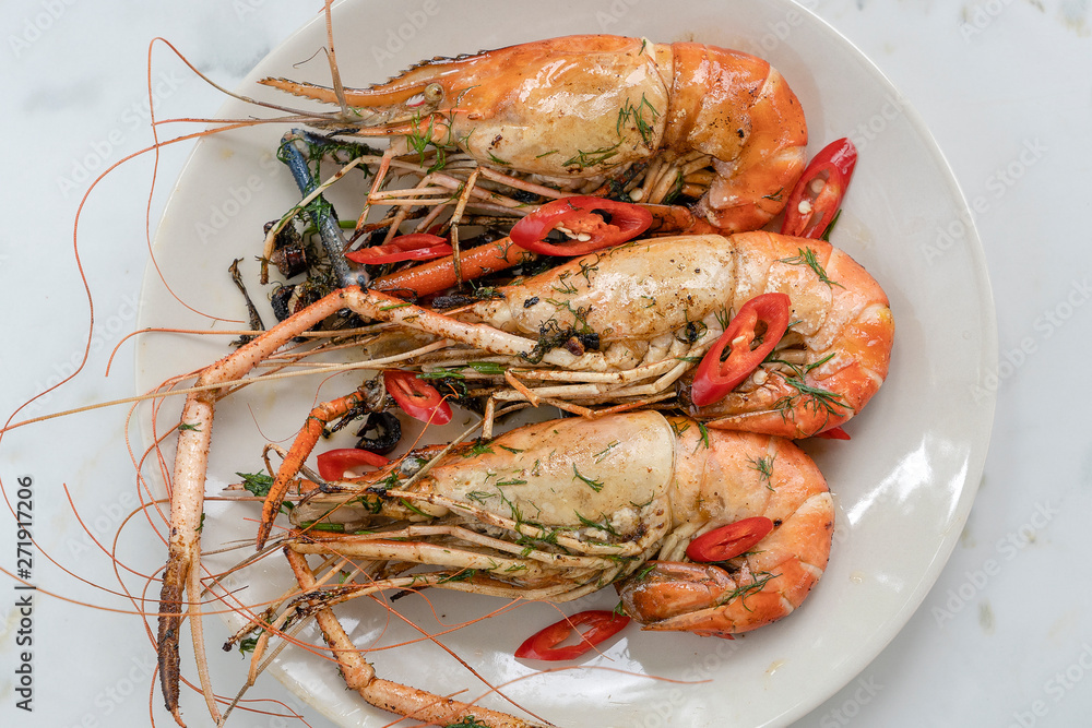 Fried king prawns with garlic and herbs, close up, Thailand Fried king prawns with garlic and herbs, close up, Thailand
