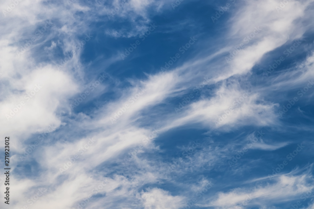 Unusual shape small fluffy clouds in the blue sky Unusual shape small fluffy clouds in the blue sky