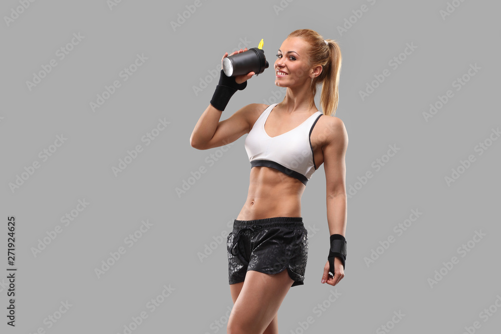 fitness girl drinking a sports drink