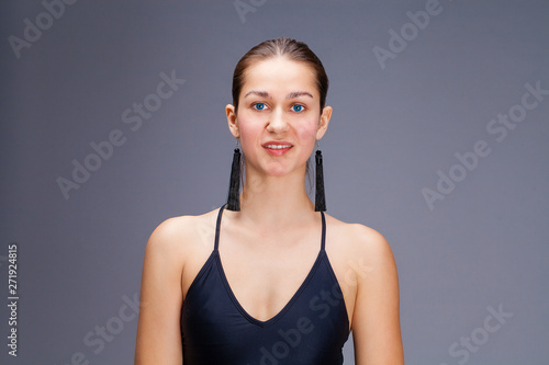 Sexy fashion brunette woman in black bathing suit