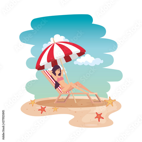 beautiful girl relaxing in beach chair on the beach