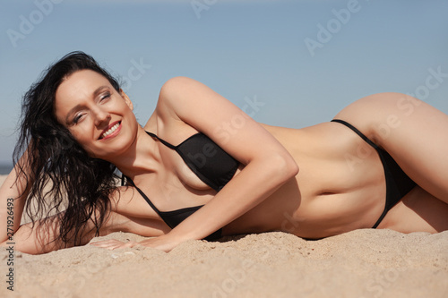 young tanned girl in bikini