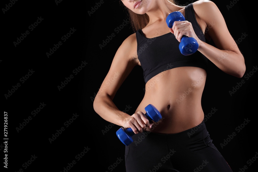 Beautiful fitness woman lifting dumbbells Beautiful fitness woman lifting dumbbells