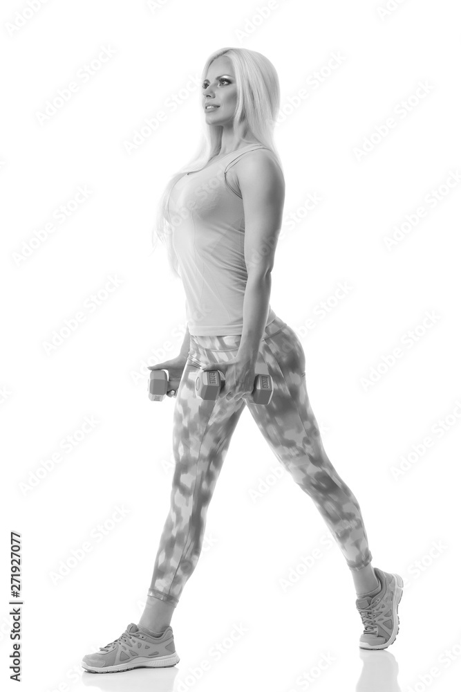 Beautiful young woman exercise with dumbbells Beautiful young woman exercise with dumbbells