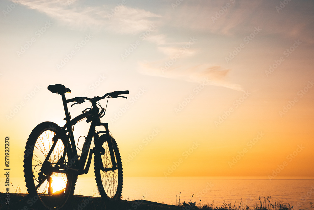 silhouette of a bicycle at sunset.