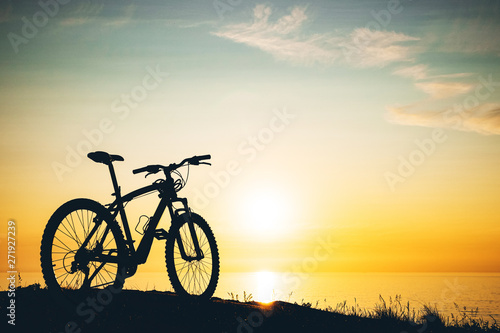 silhouette of a bicycle at sunset.