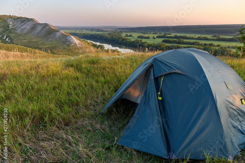 View of the camping in the mountains at sunrise