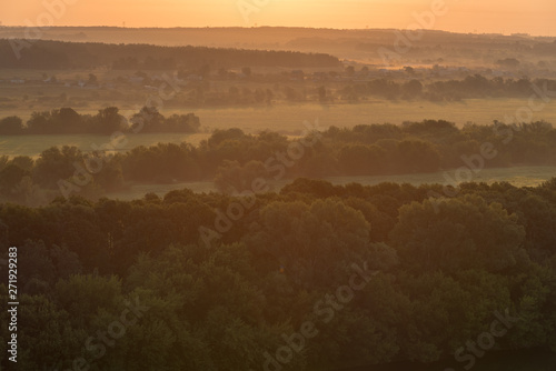 Morning landscape - flood meadows and forest at sunrise. Voronezh region, Russia