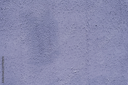 The main trend of the purple, lilac style of the concept. Plaster dirty purple wall pattern, decorative texture of the old plaster wall, stucco. Home exterior decor