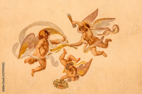COMO, ITALY - MAY 11, 2015: The detail of baroque fresco of angels with the  instruments of martyrium in church Chiesa di San Orsola Gian Domenico Caresana (1616). photo