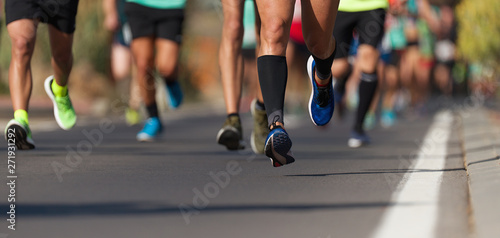 Marathon running race, people feet on city road © pavel1964