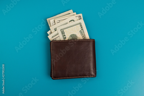Male wallet with banknotes studio image. Leather wallet with dollar bills. photo