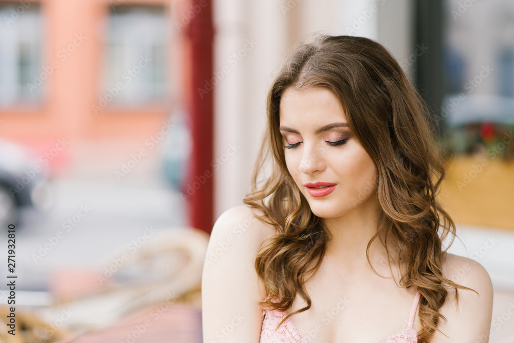 Summer portrait of a beautiful smiling girl with a bouquet of roses in her hands. professional makeup Summer portrait of a beautiful smiling girl with a bouquet of roses in her hands. professional makeup