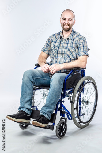 Smiling disabled man sitting in a wheelchair.
