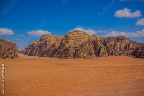 picturesque panorama photography of beautiful Wadi Rum desert scenery landscape in Middle East Jordan country with sand valley and mountain ridge background  travel destination place for tour