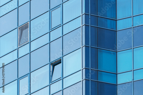 background of glass windows of modern office building