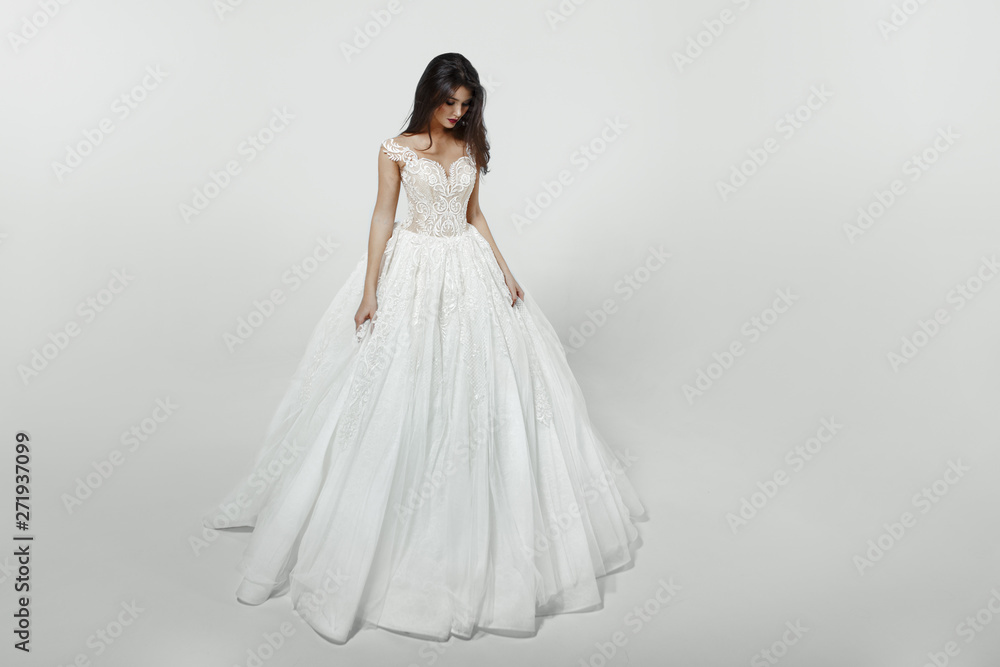 Girl in white princess fashion wedding dress, isolated on a white background. Girl in white princess fashion wedding dress, isolated on a white background.