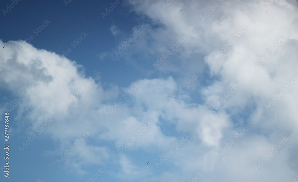 Abstract blue background with white clouds Abstract blue background with white clouds