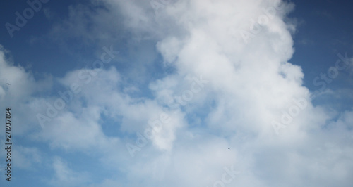 Abstract blue background with white clouds