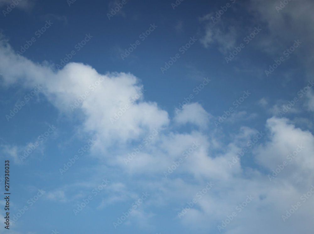 Sky blue background with clouds