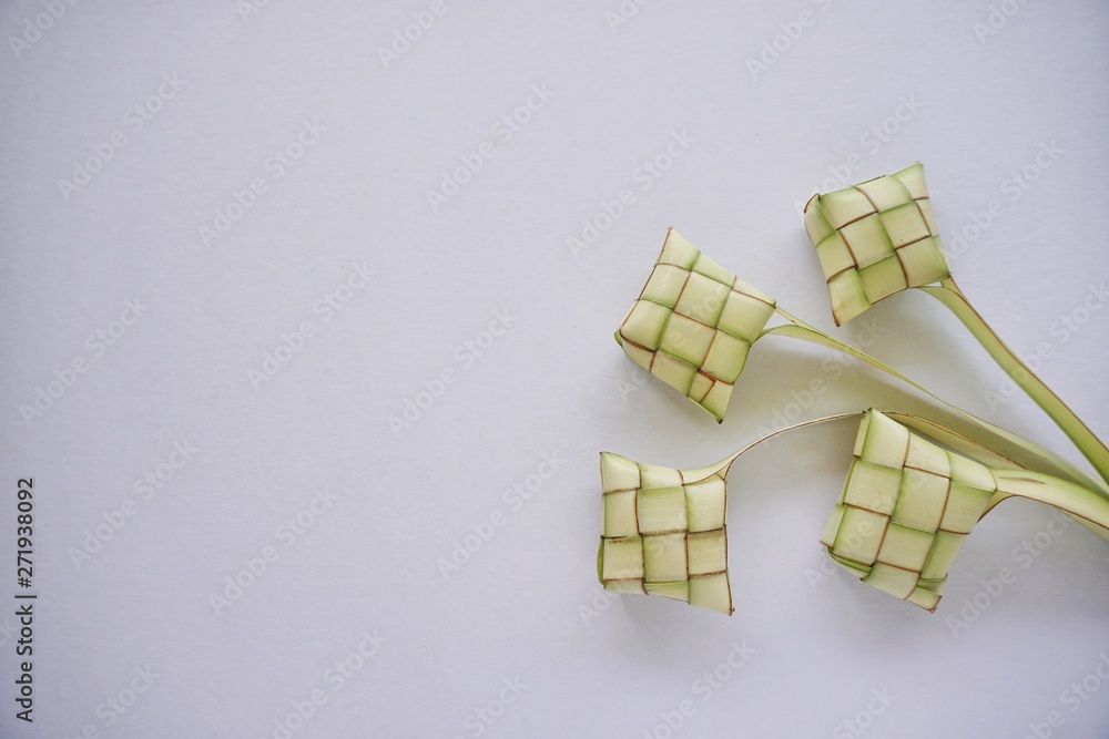 Ketupat rice dumpling, a Malaysian traditional food for Hari Raya celebration in an isolated white background.