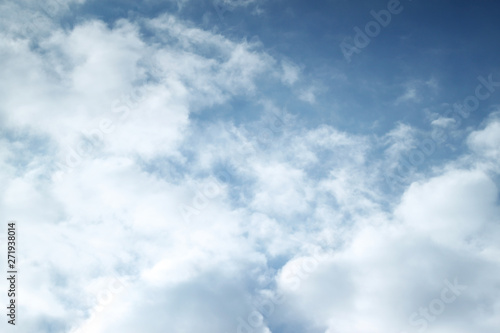 Sky blue background with white clouds