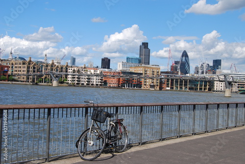 Bicycle at railing on the background of the River Thames during the daytime, London, UK