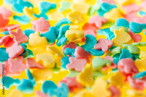 multicolored candy on a yellow background